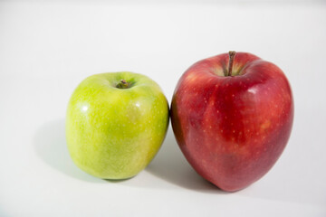 Green and red apple isolated on white background with clipping path and shiny reflections