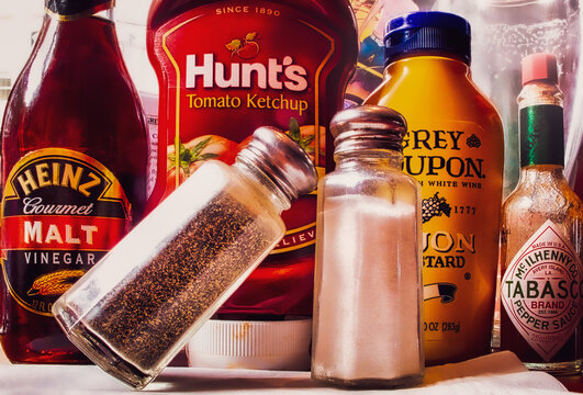 Salt, pepper and condiments mustard, catsup, hot sauce, malt vinegar 