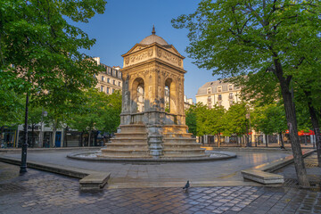 Fototapeta na wymiar Paris, France - 12 30 2020: Halles district. Fountain of the Innocents in Joachim-du-Bellay square