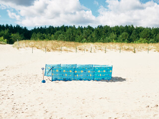 beach screen set up on the beach by the sea, sun protection on vacation
