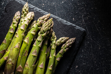 Fresh raw uncooked green asparagus.