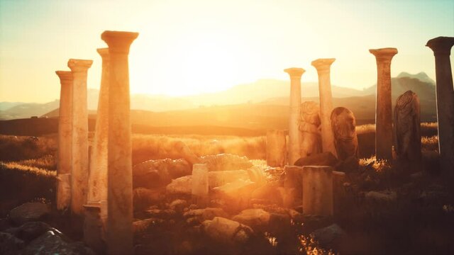 old greek temple ruins at sunset