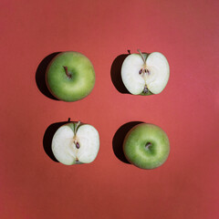 Minimalistic square composition of fresh organic green apples. Geometric food composition, contemporary flat lay arrangement.