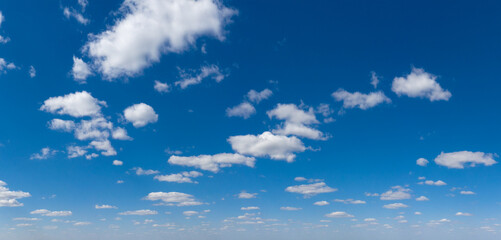 Panoramic fluffy cloud in the blue sky. Sky with cloud on a sunny day.