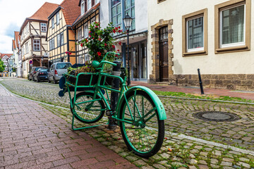 Fototapeta na wymiar Old green retro bicycle in Hamelin, Germany