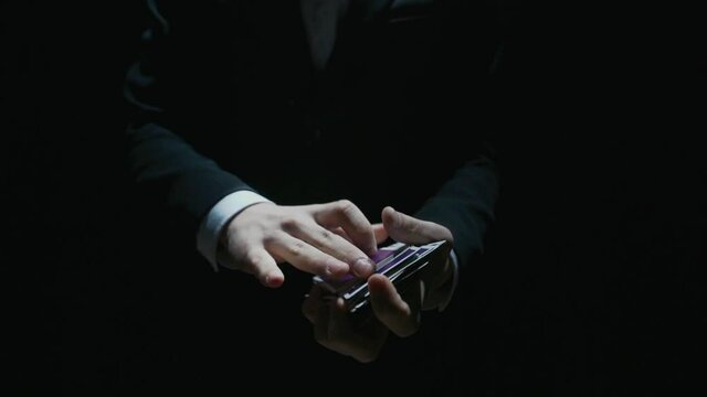 playing card flies from hand to hand in close-up. High quality FullHD footage