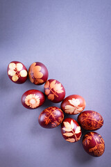 Red Easter eggs on a gray background. Easter background with eggs close-up. Place for text. Grey
background