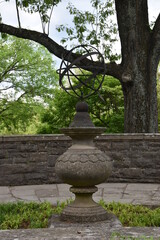 A sundial trying to do its job in the shade
