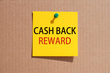 words cash back reward written on yellow square paper and pinned on craft paperboard