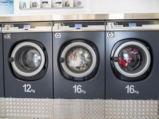 industrial washing machines in a public laundromat