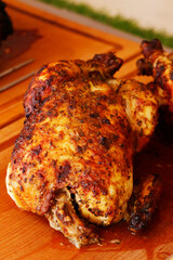 oven roasted marinated whole chicken on a carvery station