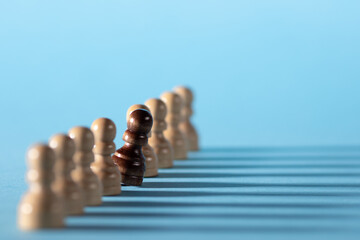 chess pieces in a row, white pawns on a blue background,