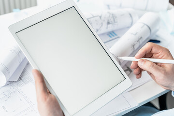 Working businessman investor.Blank tablet screen for mockup template.Financial report,presenatation.Diagram,chart,analytics,project profit evaluation.Business meeting,negotiations.CEO general manager