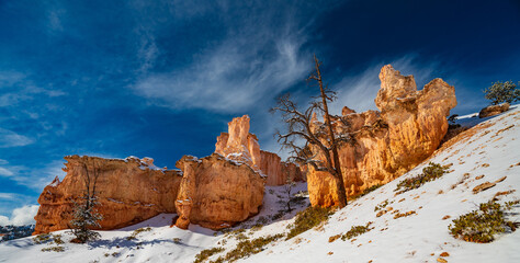 Wispy Clouds Over the Snow Covered Hoodoos of Bryce Canyon