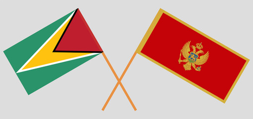 Crossed flags of Guyana and Montenegro. Official colors. Correct proportion