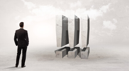 Rear view of a businessman standing in front of abbreviation concept