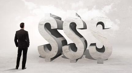 Rear view of a businessman standing in front of abbreviation concept
