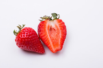 Slices of ripe red berries. Strawberries on a white background