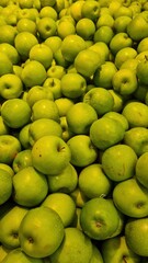 green apples stack in market for sale