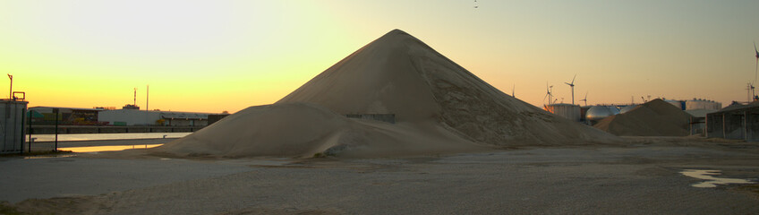Fototapeta na wymiar Sand mountain at industry site
