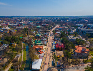 Fototapeta na wymiar Aerial view of main pedestrian Basanavicius street in spring in Palanga resort, Lithuania with many people walking in it