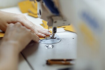 sewing machine scribbling fabric. tailoring at the factory