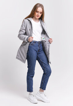 young woman in an spring jacket on a white background. advertising photo concept for store