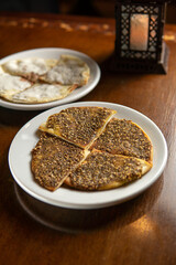 Traditional Middle Eastern food. Lebanese. Arabian cuisine. Manakish, lamps