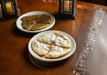 Traditional Middle Eastern food. Lebanese. Arabian cuisine. Manakish, lamps
