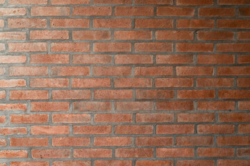 Fototapeta premium Smooth red brick wall. Texture wallpaper.