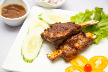 grilled goat ribs with vegetables