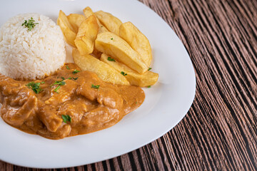 Dish Made - chicken stroganoff with rice and rustic potatoes