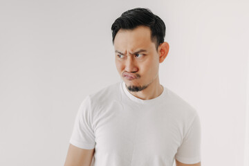 Grumpy face Asian man in white t-shirt isolated on white background.