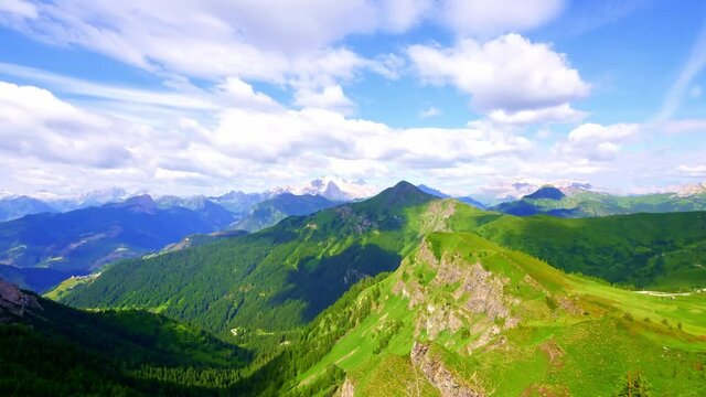 Time lapse of clouds flowing over top of Dolomites, Italy, forming shadows