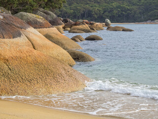 These massive granite boulders at Refuge Cove have been rounded by the waves - Wilsons Promontory,...