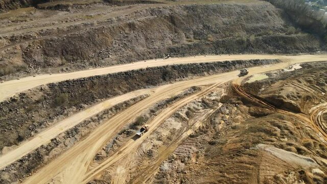 Limestone mine. Aerial view of the limestone mine with trucks and machines working in it.