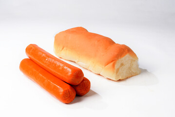 Sausages and hot dog bread on a white background