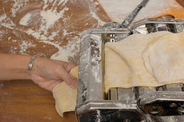 Machine stretching dough to make homemade noodles