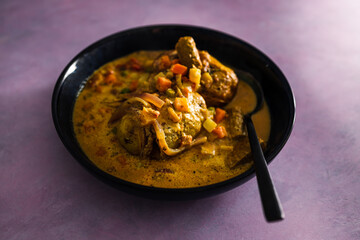 vegan roast whole potatoes with curry sauce and mixed vegetables, healthy plant-based food