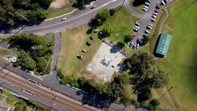 Drone aerial pan shot of Narara Skatepark Wyoming Oval with roads and train-line Gosford Central Coast NSW Australia 3840x2160 4K