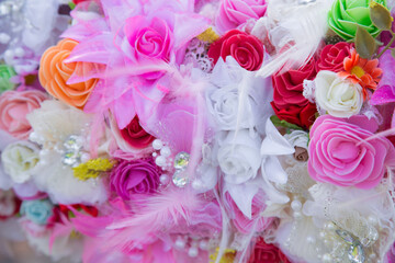 Floral background. Lot of artificial flowers in colorful composition,closeup flowers background