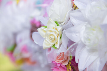 Floral background. Lot of artificial flowers in colorful composition,closeup flowers background
