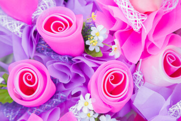 Floral background. Lot of artificial flowers in colorful composition,closeup flowers background