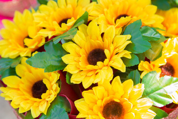 Floral background. Lot of artificial flowers in colorful composition,closeup flowers background