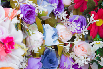 Floral background. Lot of artificial flowers in colorful composition,closeup flowers background