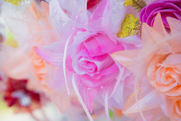 Floral background. Lot of artificial flowers in colorful composition,closeup flowers background