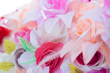 Floral background. Lot of artificial flowers in colorful composition,closeup flowers background