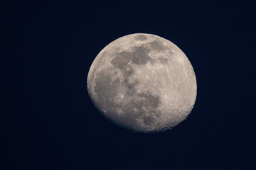 Closeup of a moon isolated on dark blue background