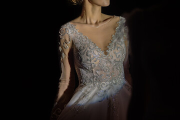 Closeup photo of gorgeous woman posing in beautiful wedding dress, home party show