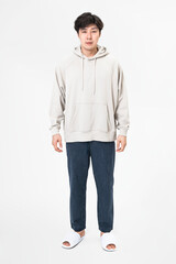 Fototapeta premium Man in beige hoodie and pants sleepwear apparel full body